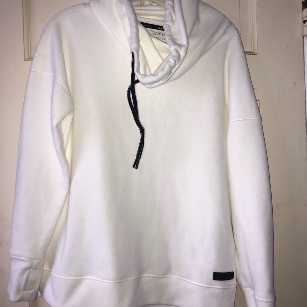 White cowl neck pull over sweatshirt.